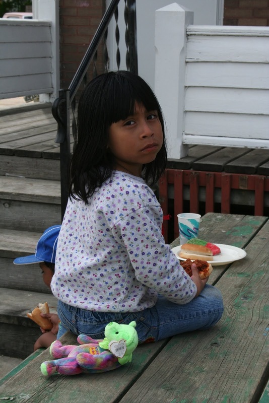 Child with food from St. Bridget's Catholic Church.JPG