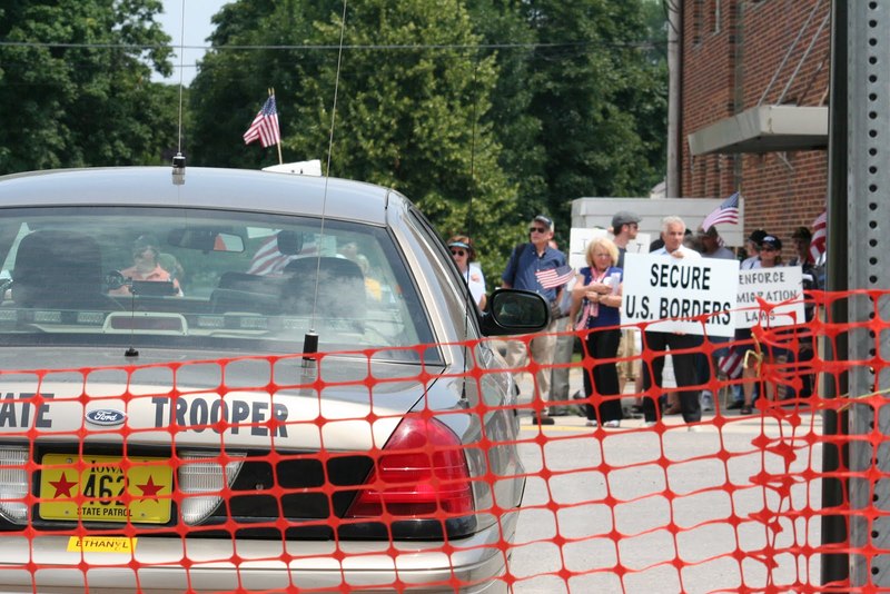 Police car, protestors.JPG