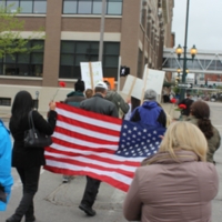 Marchers with American flag.JPG