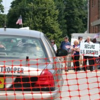 Police car, protestors.JPG