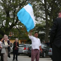Sister Mary McCauley, marcher with Guatemalan flag