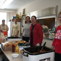 Volunteers serving food at St. Bridget&#039;s Catholic Church